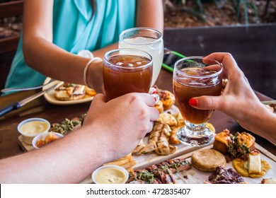 Fresh Roast Beef On Wood With Soft Drinks Over Table Bbq. People Eating