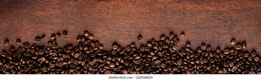 Fresh Roasted Coffee Beans On Natural Dark Oak Wood Panorama Wide Wooden Closeup Macro Background