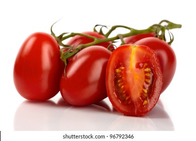 Fresh Roma Tomatoes Cut In Front Of White Background