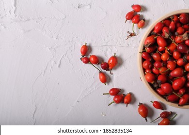fresh rosehip fruits are on the table	