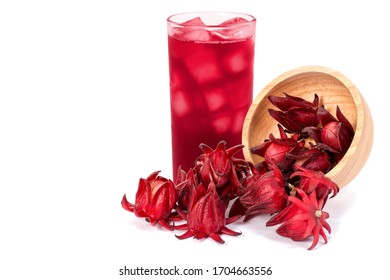 Fresh Roselle fruit ( Jamaica sorrel, Rozelle or hibiscus sabdariffa ) in wooden bowl and glass of roselle juice tea isolated on white background. 