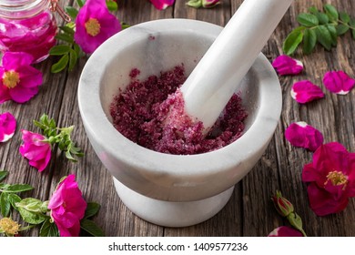 Fresh Rugosa Rose Flowers Crushed With Cane Sugar In A Marble Mortar