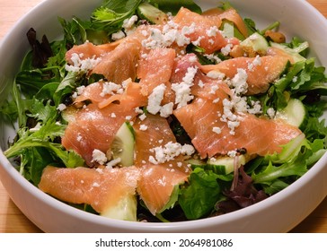 Fresh Salad With Atlantic Smoked Salmon And Crumbled Goat Cheese On Bed Of Spring Mix Lettuce