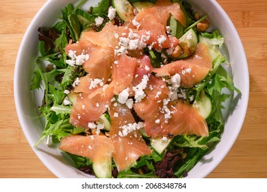 Fresh Salad With Atlantic Smoked Salmon And Crumbled Goat Cheese On Bed Of Spring Mix Lettuce