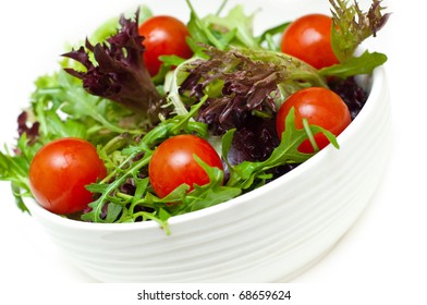 fresh salad in a bowl on a white background