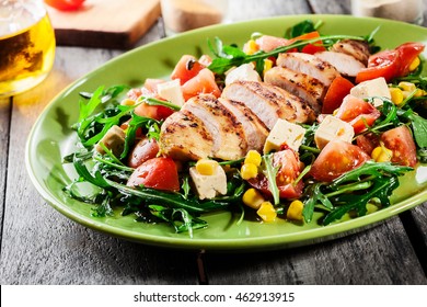 Fresh Salad With Chicken Breast, Arugula And Tomato On A Plate