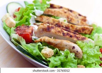Fresh salad with chicken breast,lettuce and tomatoes