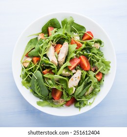 Fresh Salad With Chicken, Tomato And Greens (spinach, Arugula) On Blue Wooden Background Top View. Healthy Food.