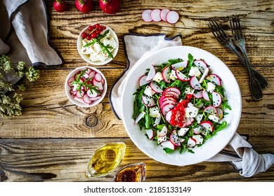 Fresh Salad - Feta Cheese, Radish And Leafy Greens On Wooden Table 