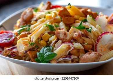 Fresh Salad With Grilled Chicken Meat And Pasta - Close Up View