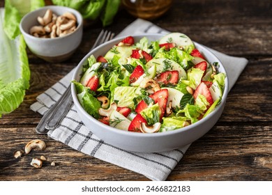 Fresh salad with lettuce leaves, apples, strawberries and cashew nuts	
 - Powered by Shutterstock