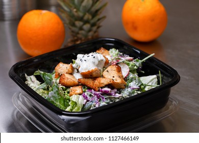 Fresh Salad Meal Packed In A Plastic Container Ready To Eat - Healthy Takeaway Food And Eating Concept. Shot In A Real Healthy Fast Food Kitchen, Ready For Delivery.   