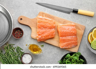 Fresh salmon fillet on wooden board