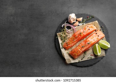 Fresh Salmon And Ingredients For Marinade On Slate Plate