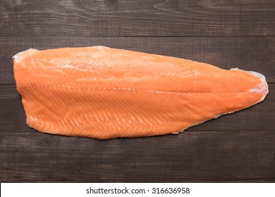 Fresh Salmon On The Wooden Table. Top View.