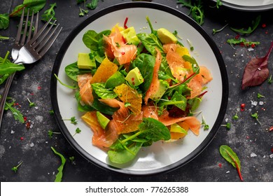 Fresh salmon salad with avocado, orange and green vegetables. - Powered by Shutterstock