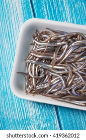 Fresh Sand Eel Fish On A Wooden Table.