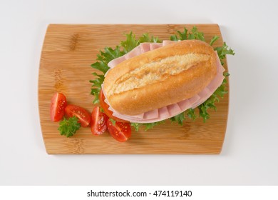 Fresh Sandwich With Ham On Wooden Cutting Board