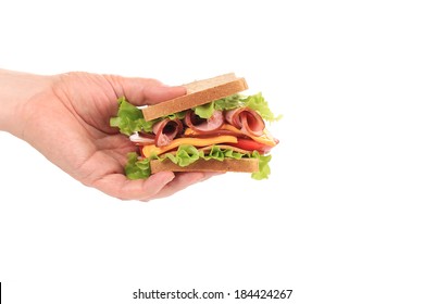 Fresh Sandwich In Hand. Isolated On A White Background.
