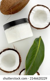 Fresh Scrub In Jar With Coconut On White Background. Home Spa Treatment Concept, Organic Cosmetic. Vertical Photo