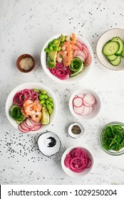 Fresh seafood recipe. Shrimp salmon poke bowl with fresh prawn, brown rice, cucumber, pickled sweet onion, radish, soy beans edamame portioned with black and white sesame. Food concept poke bowl
