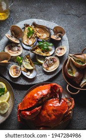 Fresh Seafood Shellfish Mussels, Clams, Crabs And Snails On Gray Background