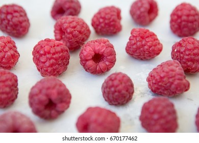 Fresh selective raspberry on white marble