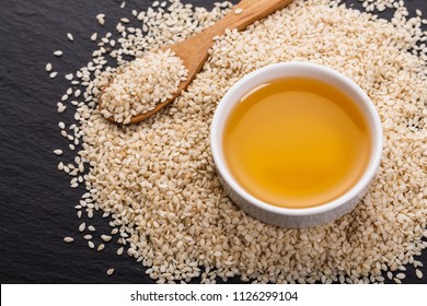 fresh sesame seeds on a rustic background - Shutterstock ID 1126299104