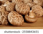 fresh shiitake mushrooms on wooden background