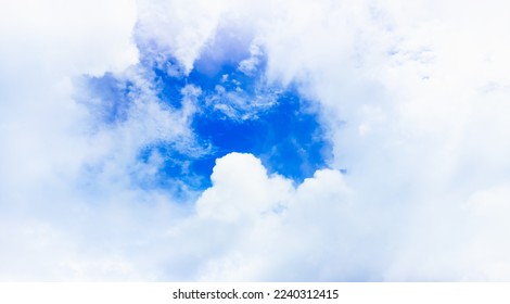 Fresh sky open and white soft clouds cleared after a rainstorm. View of good weather again on a hot summer day. There is a space to put text on photo. Idea for a feeling of fresh weather. - Shutterstock ID 2240312415