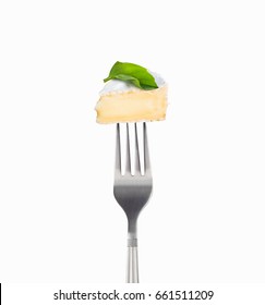 Fresh Slice Camembert Cheese On A Fork Isolated On White Background