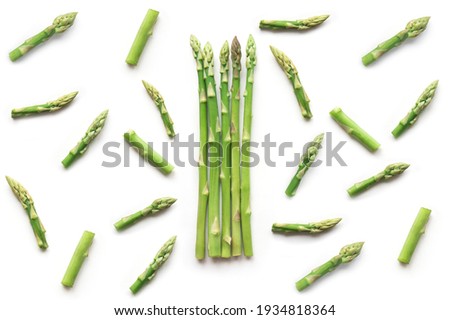 Fresh sliced asparagus plant on white background. Top view. Vegan healthy food. 