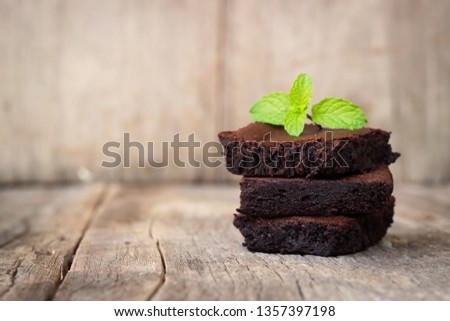 Similar – Chocolate brownie pieces on wooden background