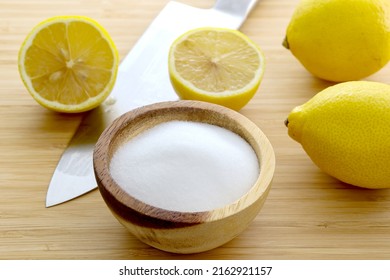 Fresh Sliced Lemon With Salt On Bamboo Table. Use For Safe Home Cleaning And DIY Household Nontoxic Cleaning Product Concept.