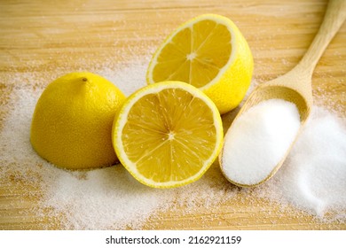 Fresh Sliced Lemon With Salt On Bamboo Table. Use For Safe Home Cleaning And DIY Household Nontoxic Cleaning Product Concept.