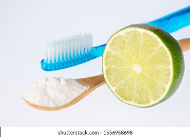 Fresh Sliced Lime, Baking Soda And Toothbrush - Text Space