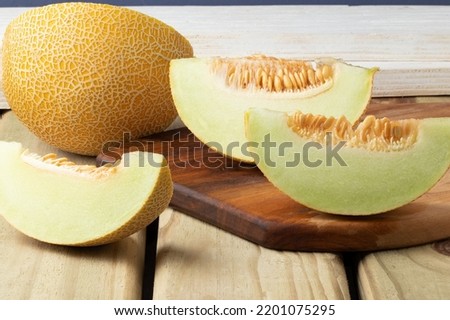 Fresh sliced melon on table. 