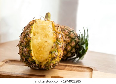 Fresh Sliced Pineapple On Wooden Tray On Table.