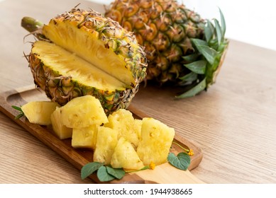 Fresh Sliced Pineapple On Wooden Tray On Table.