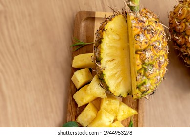 Fresh Sliced Pineapple On Wooden Tray On Table.