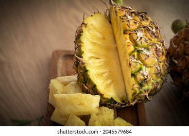 Fresh Sliced Pineapple On Wooden Tray On Table.