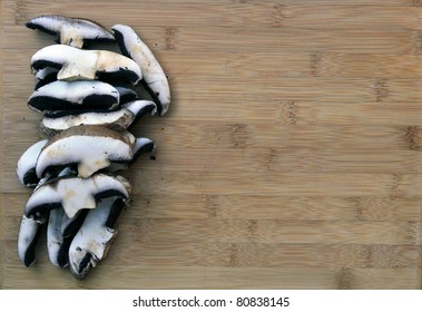 Fresh Sliced Portabella Mushrooms On Clean Cutting Board