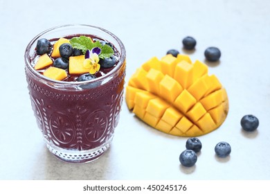 Fresh Smoothie With Mango And Blueberry Topping