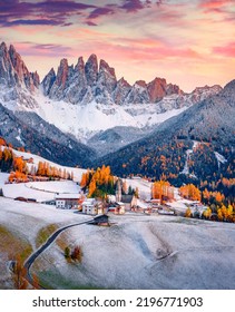 Fresh snow covered green hills on Santa Magdalena village. Fantastic autumn view of Seceda peak. Incredible landscape of Dolomite Alps, Italy. Traveling concept background. - Shutterstock ID 2196771903