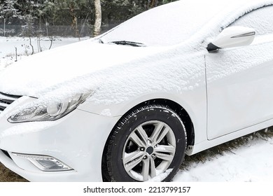 Fresh Snow Layer On Windscreen, Windshield, Window Of Car In Driveway Parking Lot Spot. Automobile In Blizzard Snowfall Snowstorm In Winter.vehicle In Extreme Weather -Kiev, Ukraine, 9 January 2022.