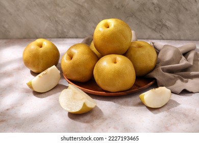 Fresh Snow pear or nashi pear (Golden pear)fruits delicious and sweet on pink background.