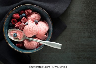 Fresh of soft icre cream or frozen yogurt with berry fruit flavours