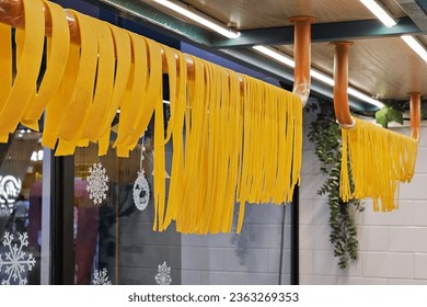 Fresh Spaghetti Hanging on Drying Rack. - Powered by Shutterstock