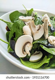 Fresh Spinach Salad With Sliced Mushrooms And Olive Oil