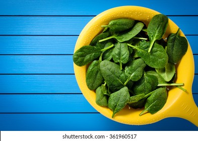 Fresh Spinach In Yellow Colander